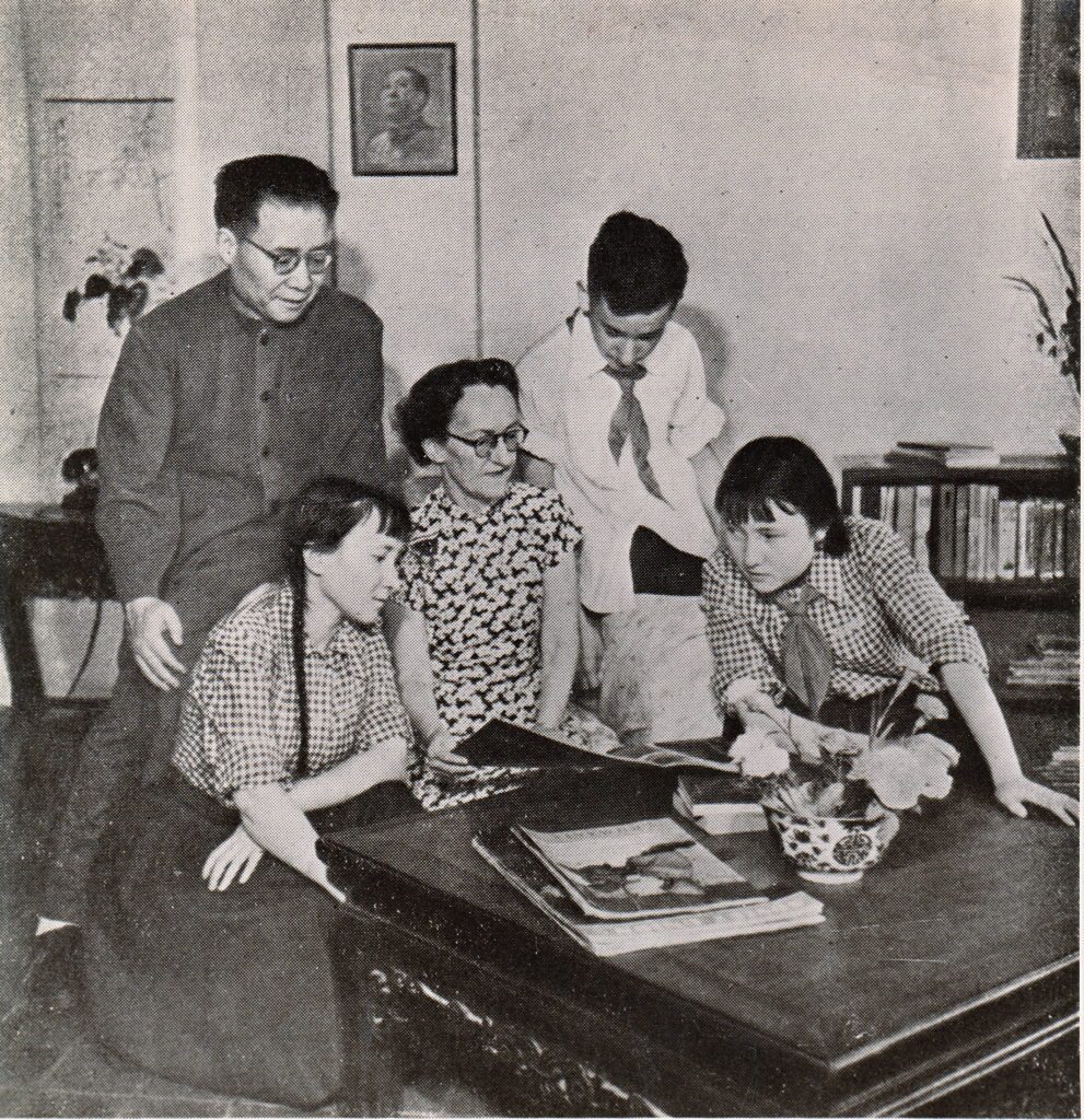 1953 Liu family. Grace is reading the article she wrote for China Reconstructs.
