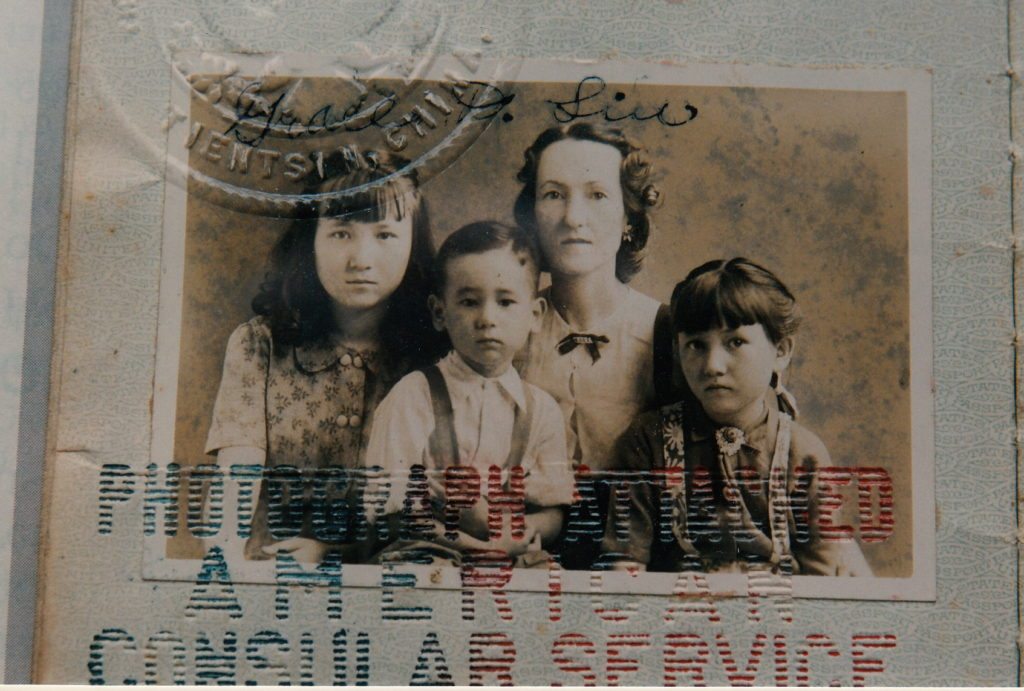 Passport photo of Grace and her three children after World War II.